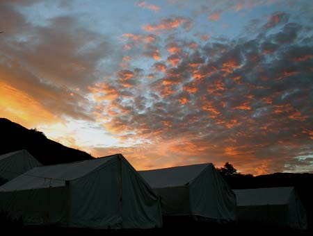 safari tent camp at dawn